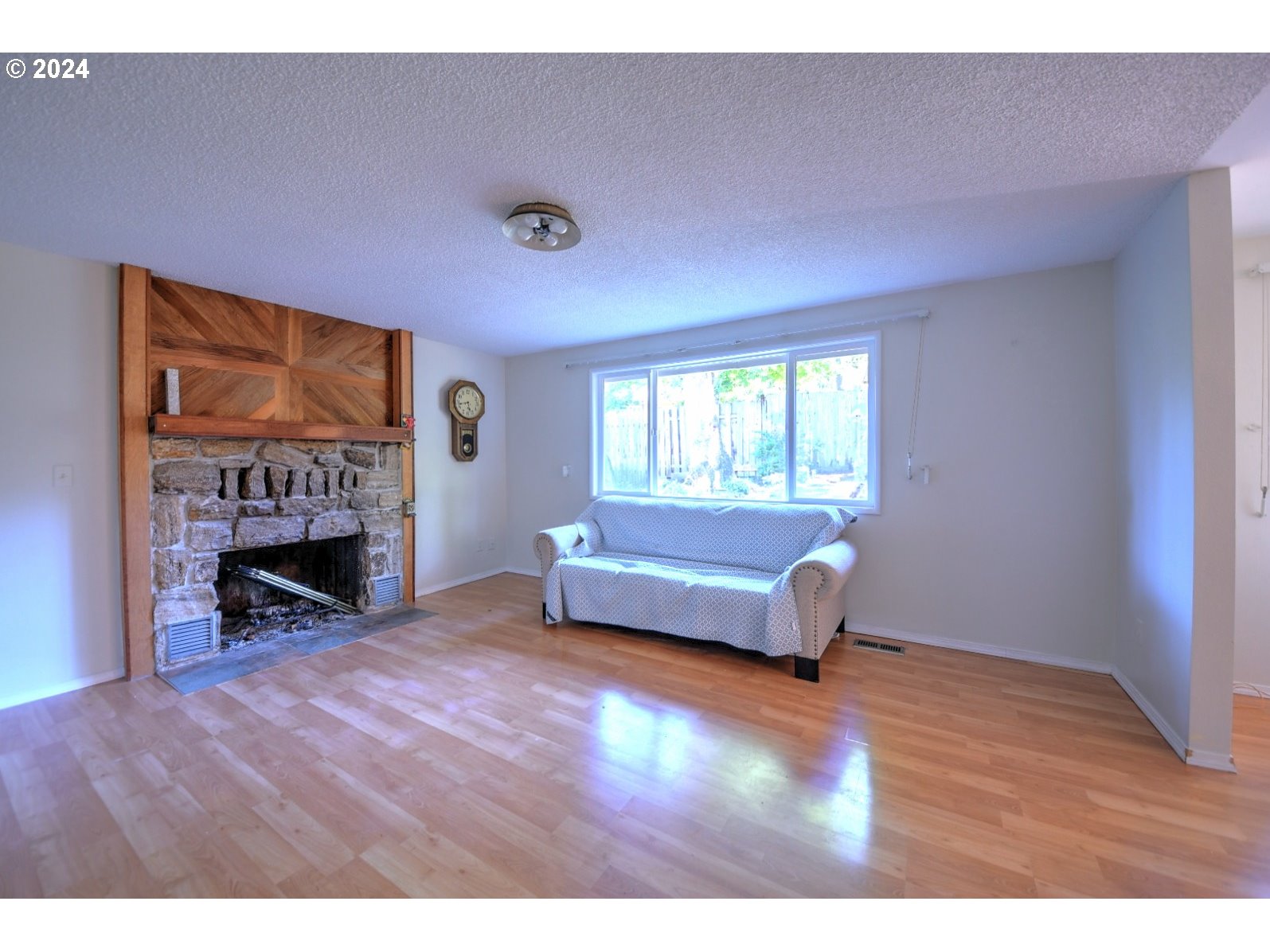 443 South 68th Place Springfield, OR 97478 - Photo 12 of 32 a living room with furniture and a fireplace