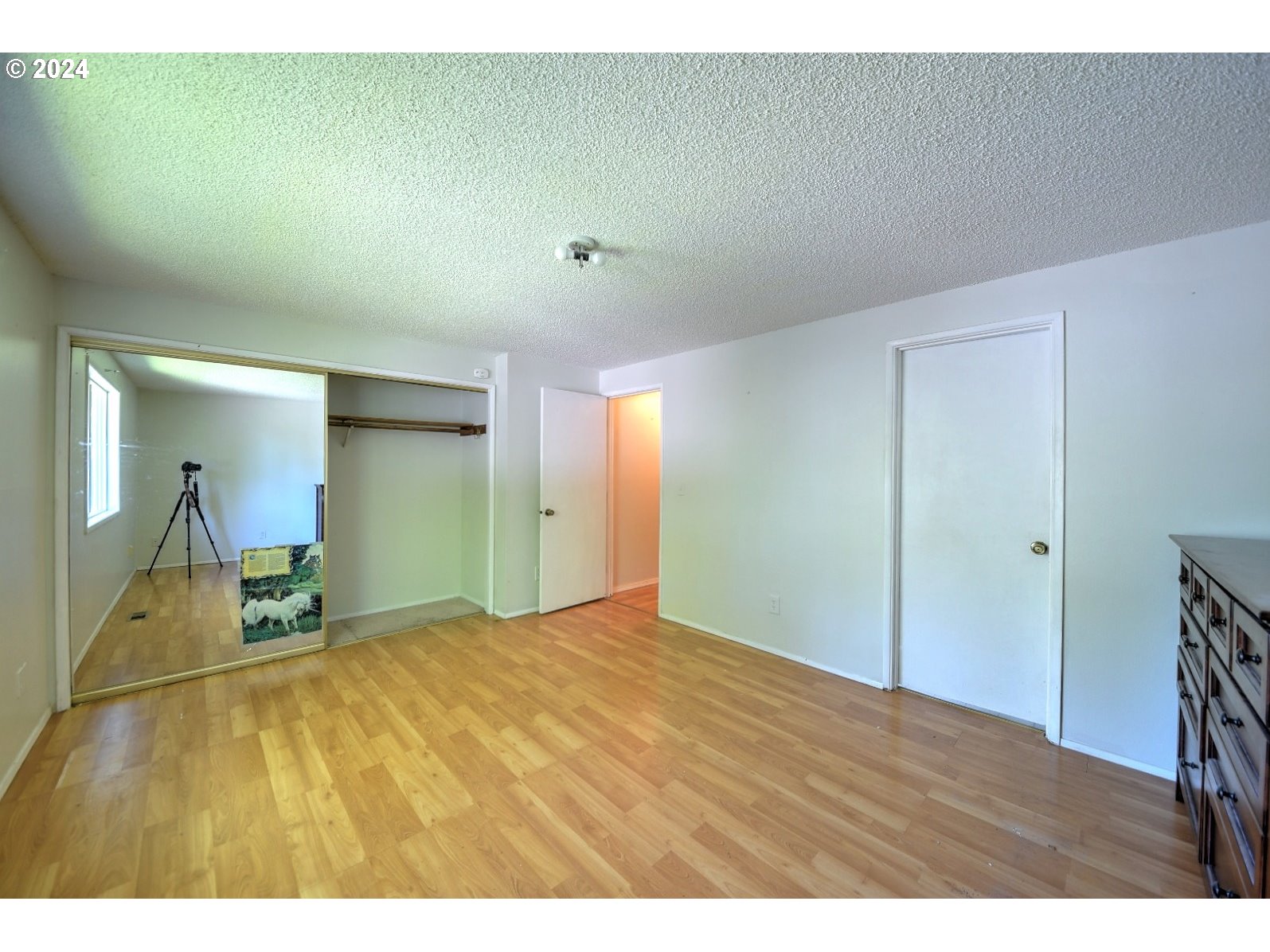 443 South 68th Place Springfield, OR 97478 - Photo 17 of 32 a view of empty room with wooden floor