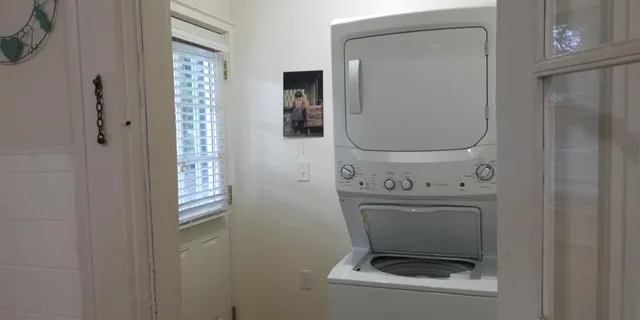 a bathroom with a toilet mirror and a sink