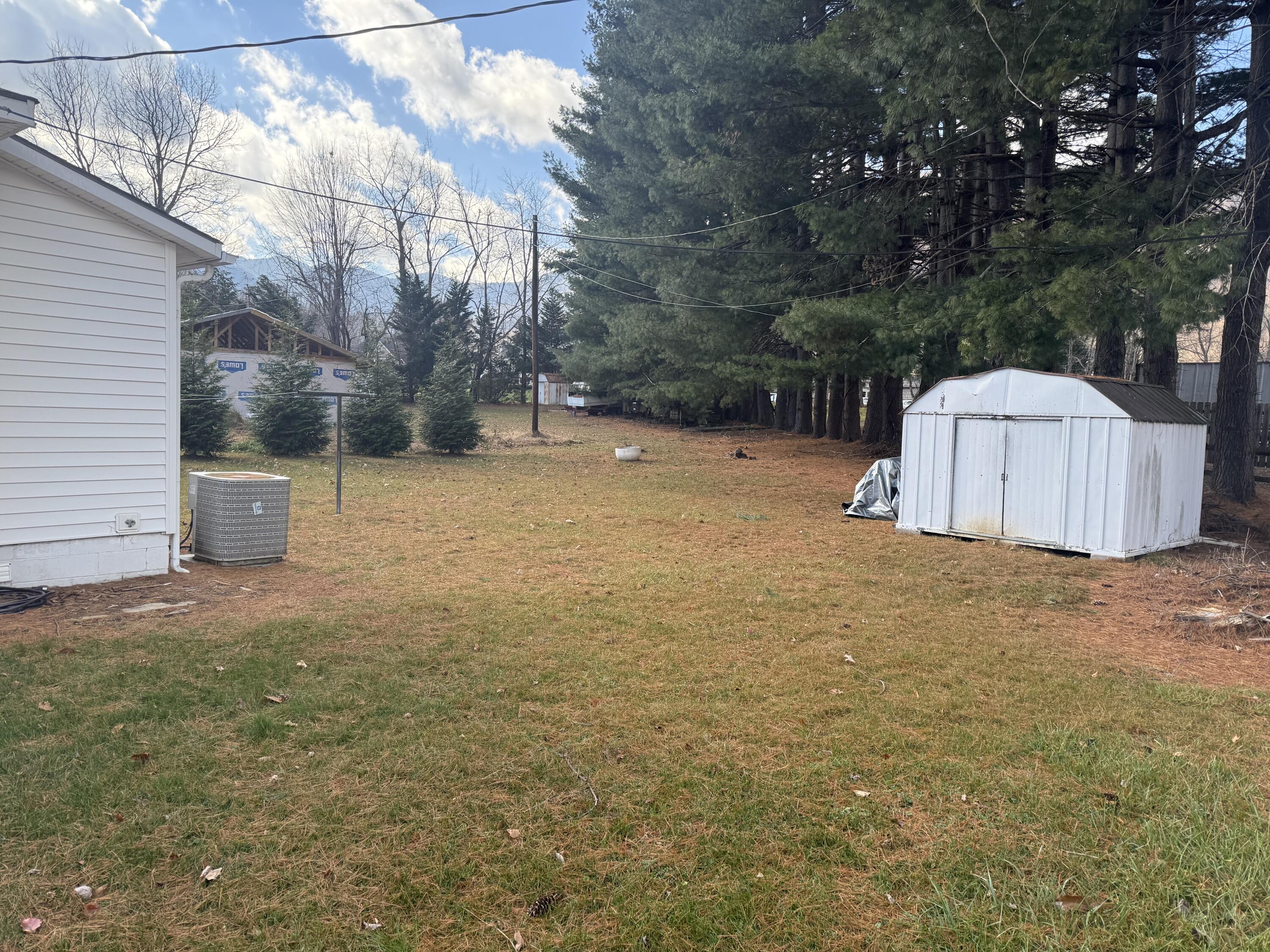 62 Campbell Creek Road Maggie Valley, NC 28751 - Photo 14 of 15 a backyard of a house with trees and houses