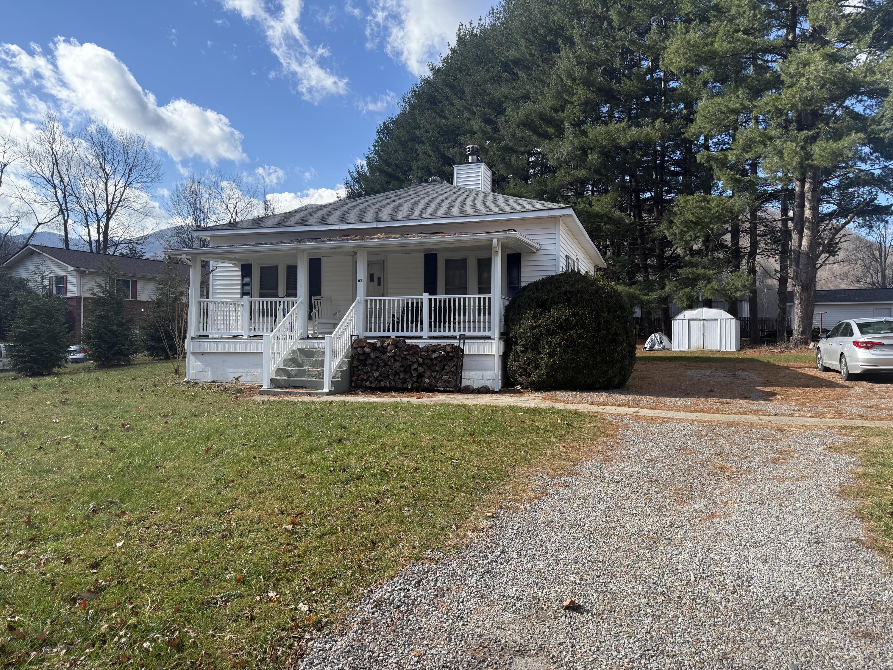 62 Campbell Creek Road Maggie Valley, NC 28751 - Photo 3 of 15 a front view of a house with a yard and trees