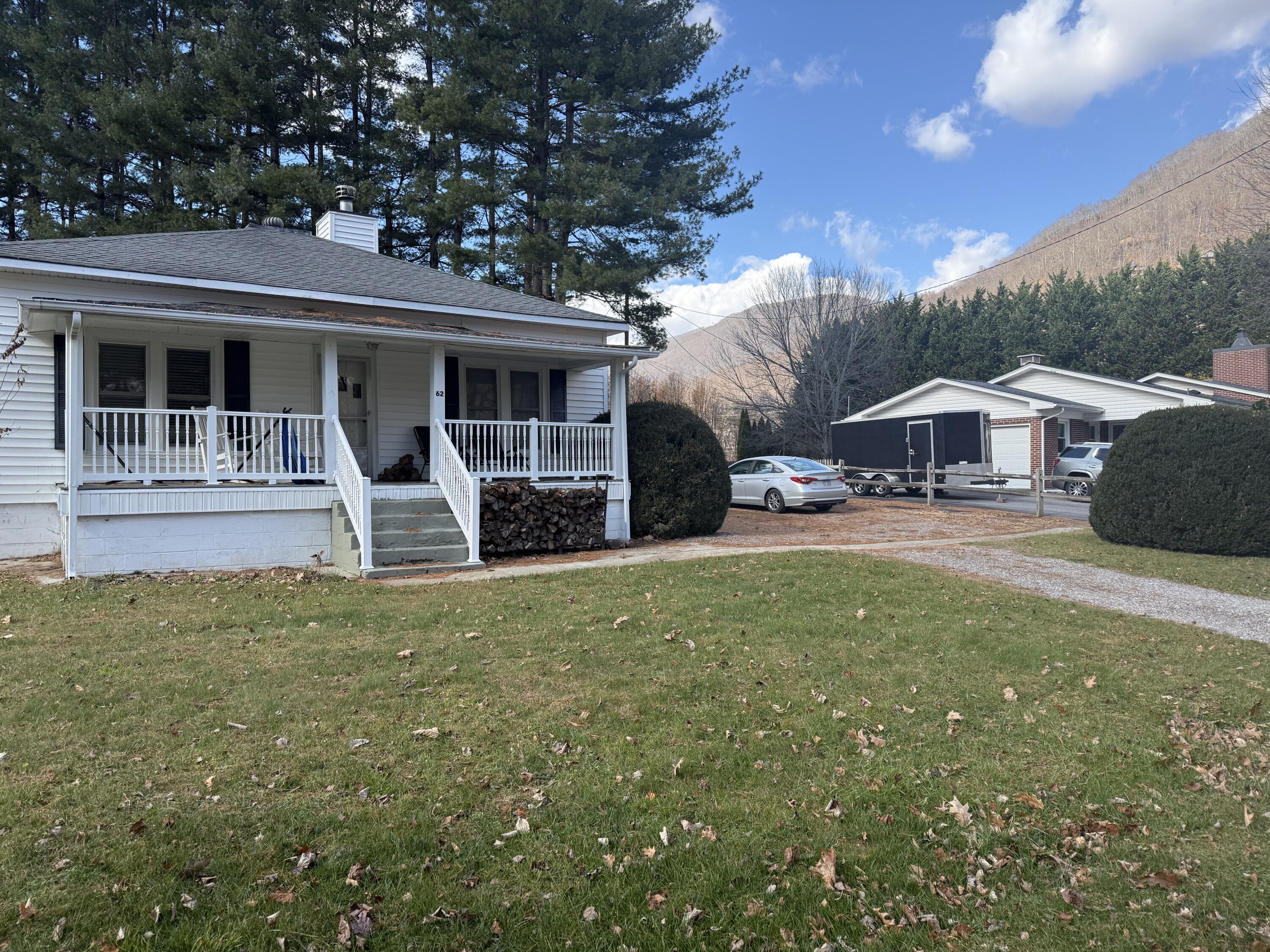 62 Campbell Creek Road Maggie Valley, NC 28751 - Photo 4 of 15 a front view of a house with garden