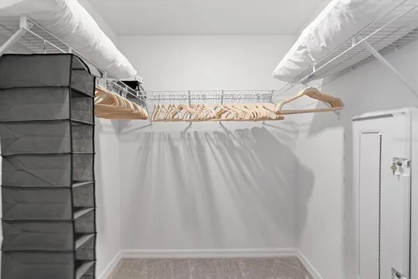 a bedroom with a bed and chair