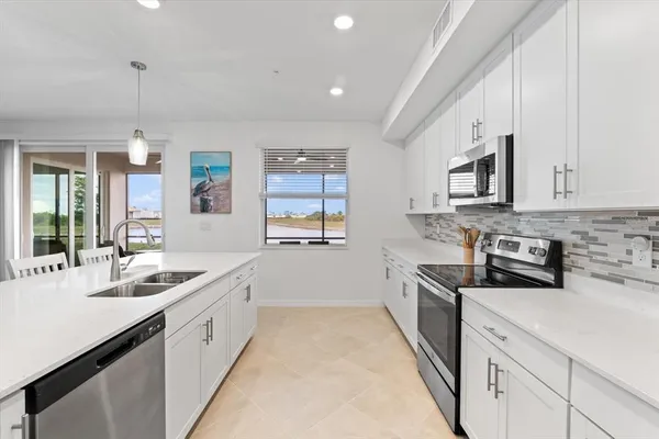 a stove top oven sitting inside of a kitchen