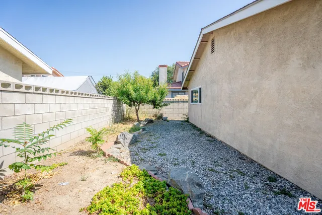 a kitchen with a refrigerator and a stove top oven