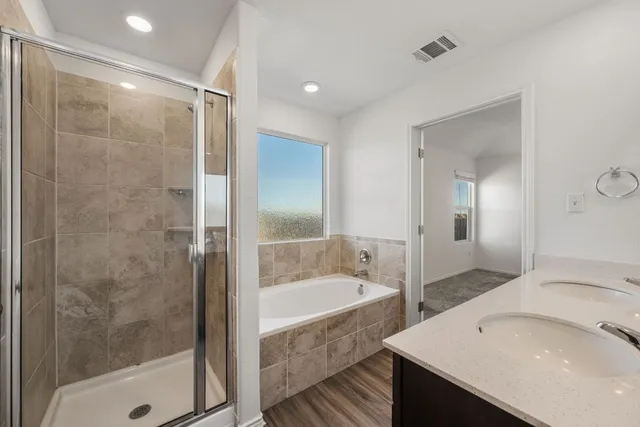 a bathroom with a bathtub and a sink