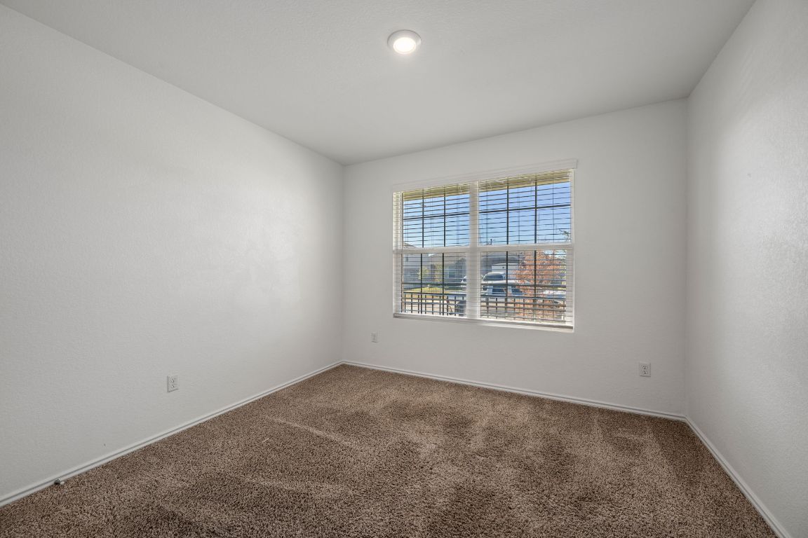 3206 Dusted Daisey Street Pflugerville, TX 78660 - Photo 15 of 25 an empty room with a window