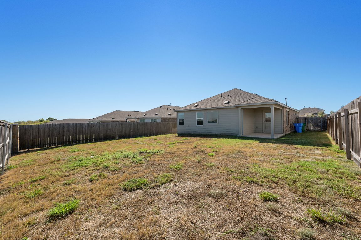 3206 Dusted Daisey Street Pflugerville, TX 78660 - Photo 21 of 25 a front view of a house with a yard