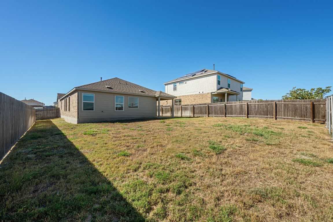 3206 Dusted Daisey Street Pflugerville, TX 78660 - Photo 23 of 25 a front view of a house with a yard