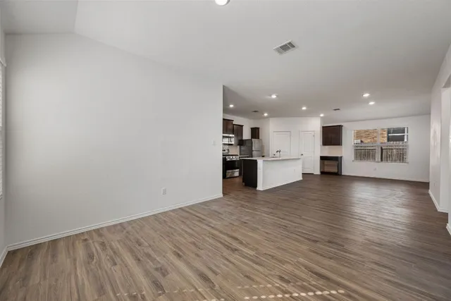 a view of a kitchen with a microwave and stove