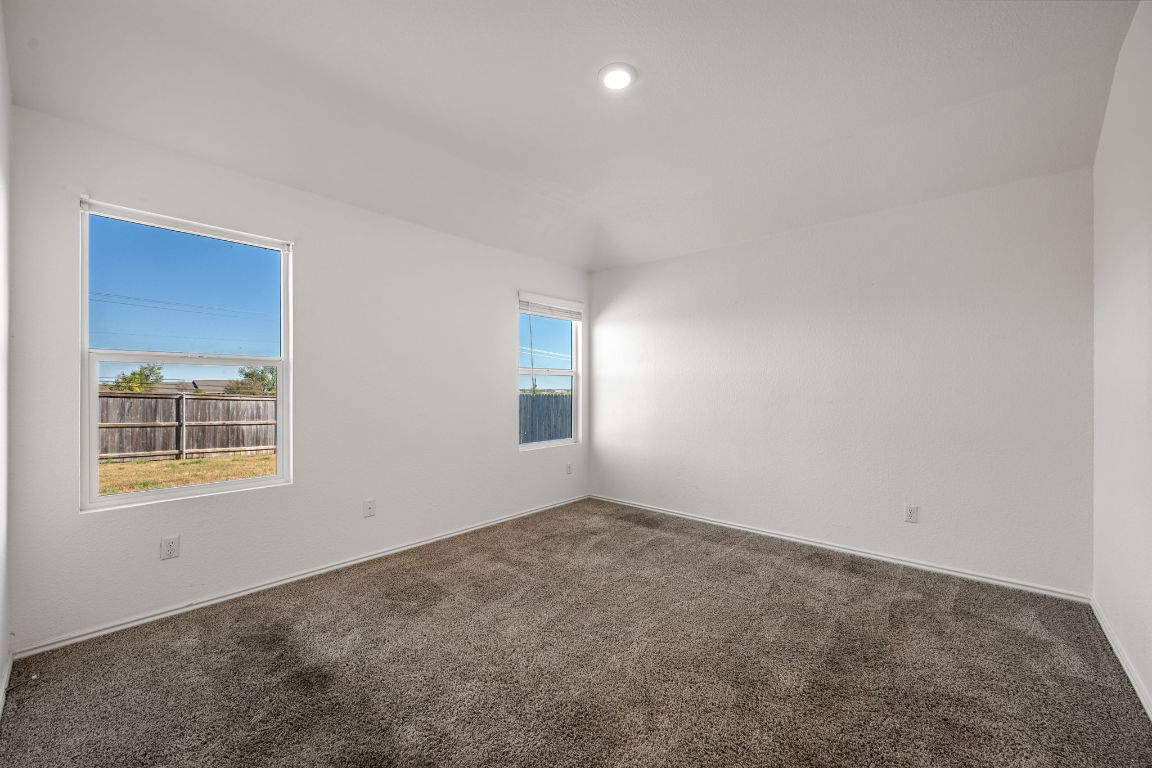 3206 Dusted Daisey Street Pflugerville, TX 78660 - Photo 10 of 25 an empty room with a window