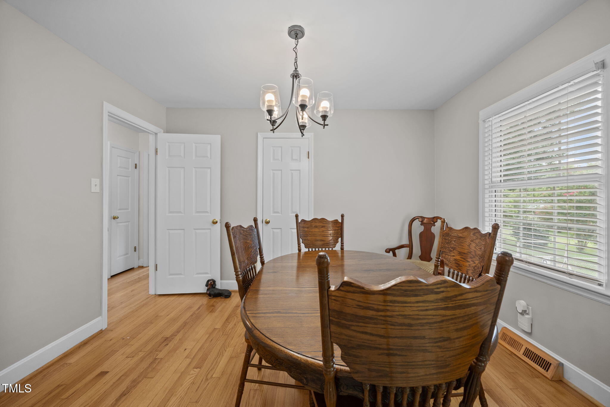 407 North 9th Street Mebane, NC 27302 - Photo 15 of 42 a view of a dining room with furniture window and wooden floor