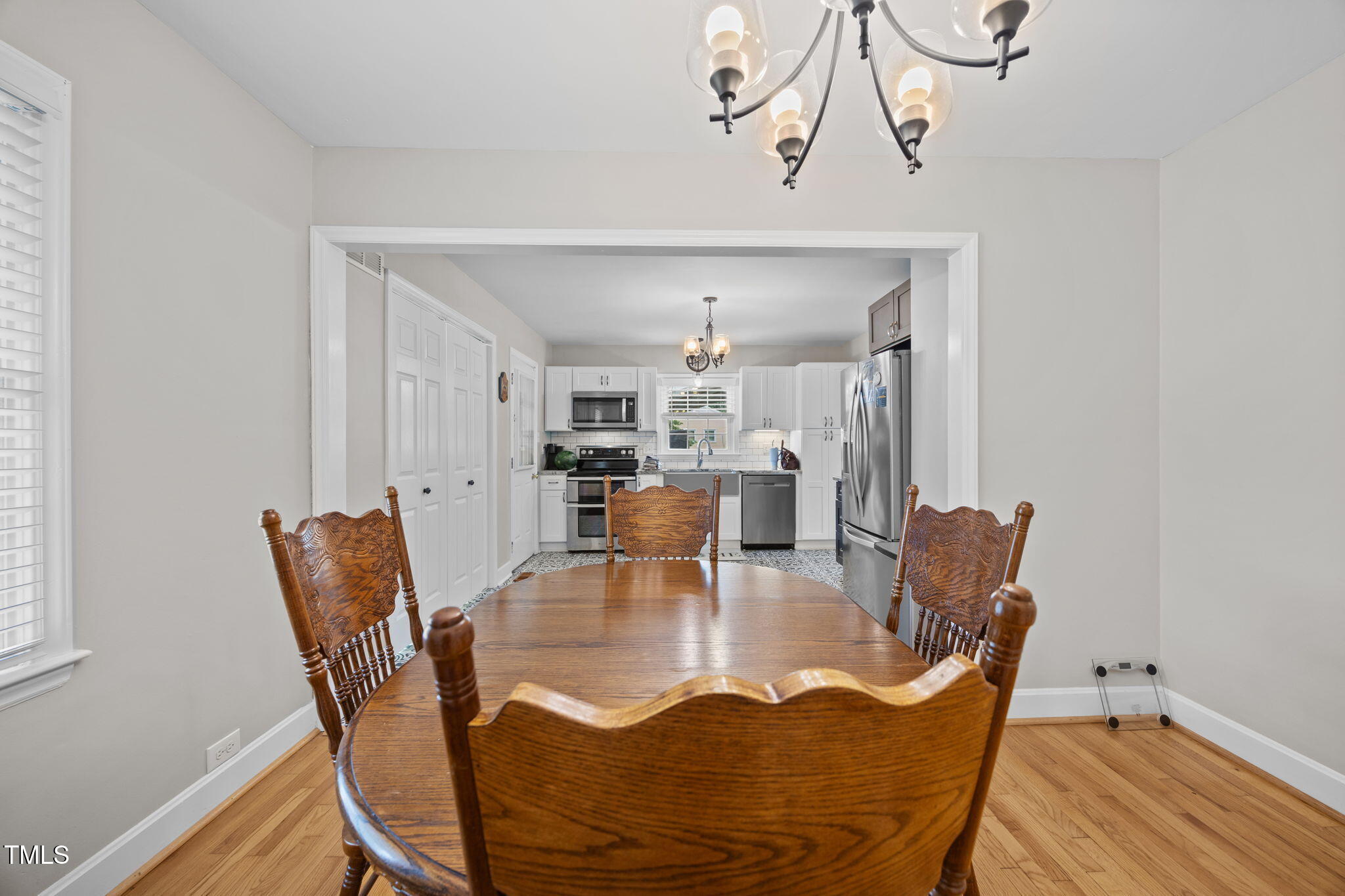 407 North 9th Street Mebane, NC 27302 - Photo 17 of 42 a view of a dining room with furniture and wooden floor