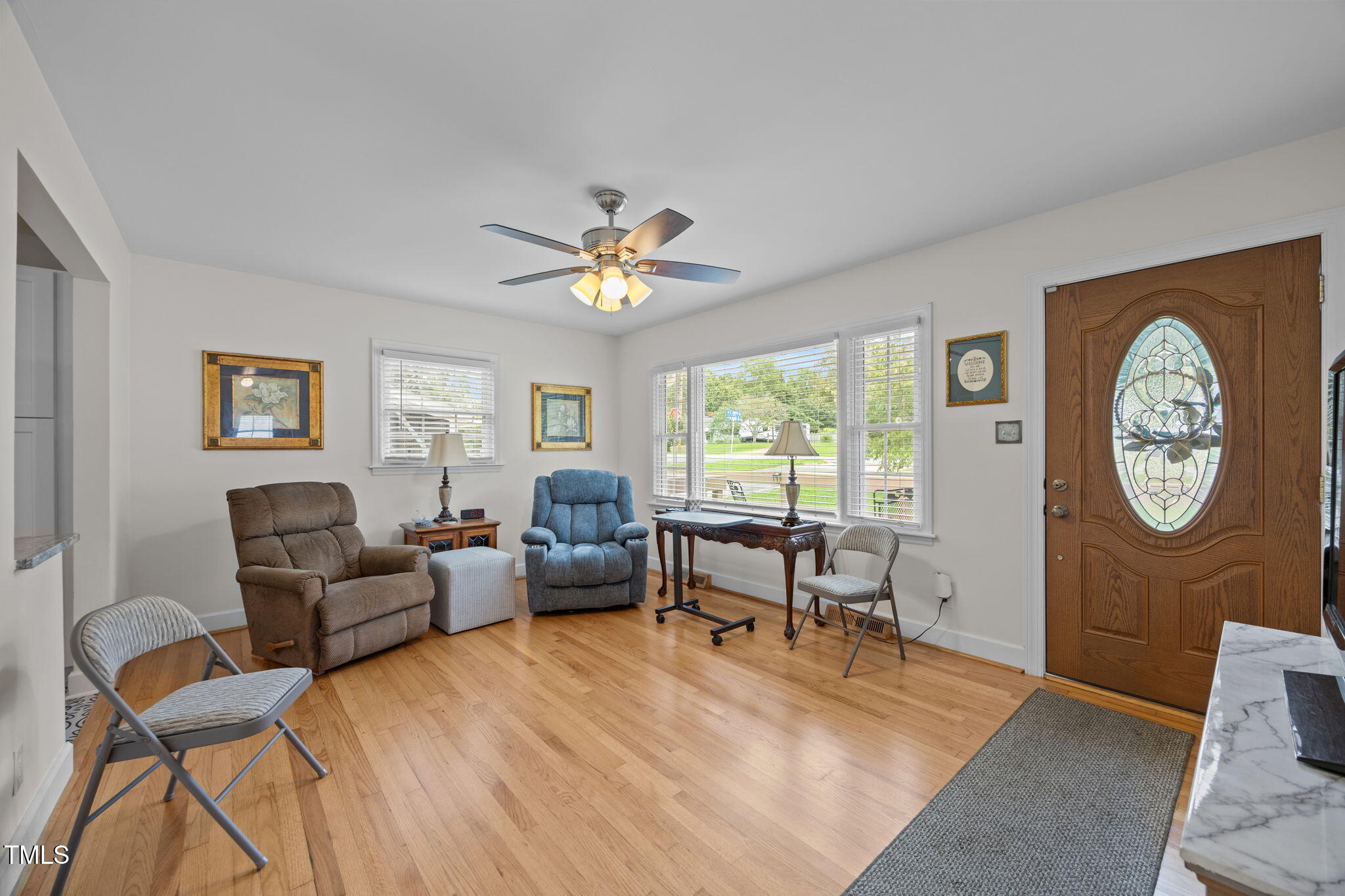 407 North 9th Street Mebane, NC 27302 - Photo 19 of 42 a living room with furniture a window and a clock