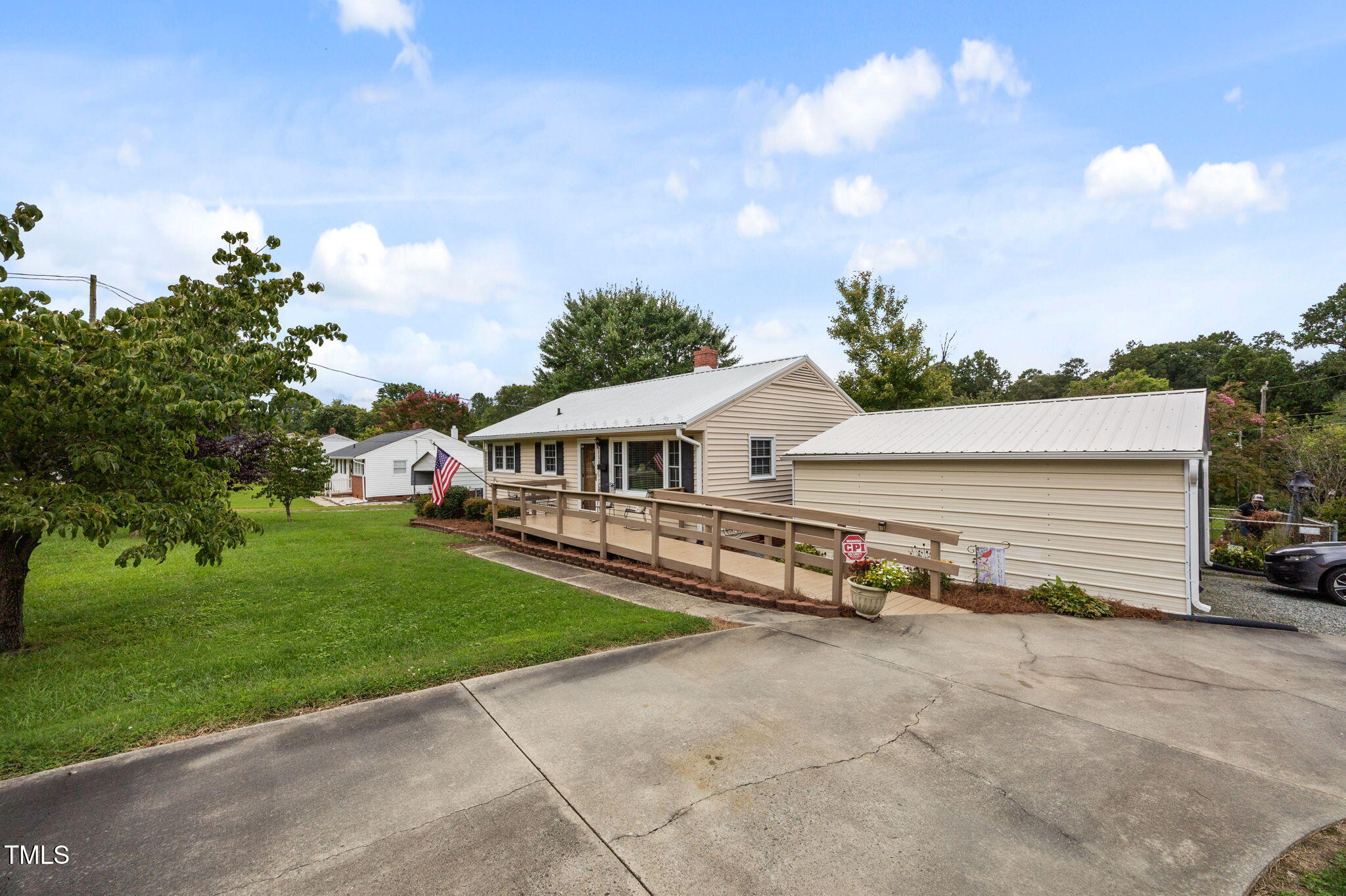 407 North 9th Street Mebane, NC 27302 - Photo 2 of 42 a view of a house with many windows and a yard