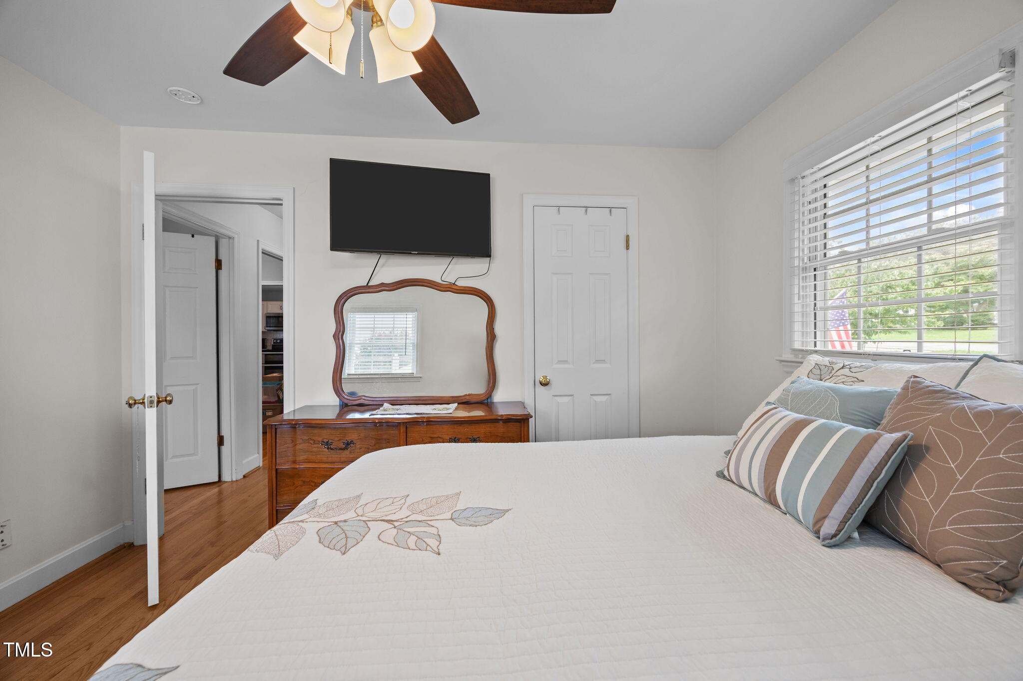407 North 9th Street Mebane, NC 27302 - Photo 24 of 42 a bedroom with a large bed and a flat tv screen