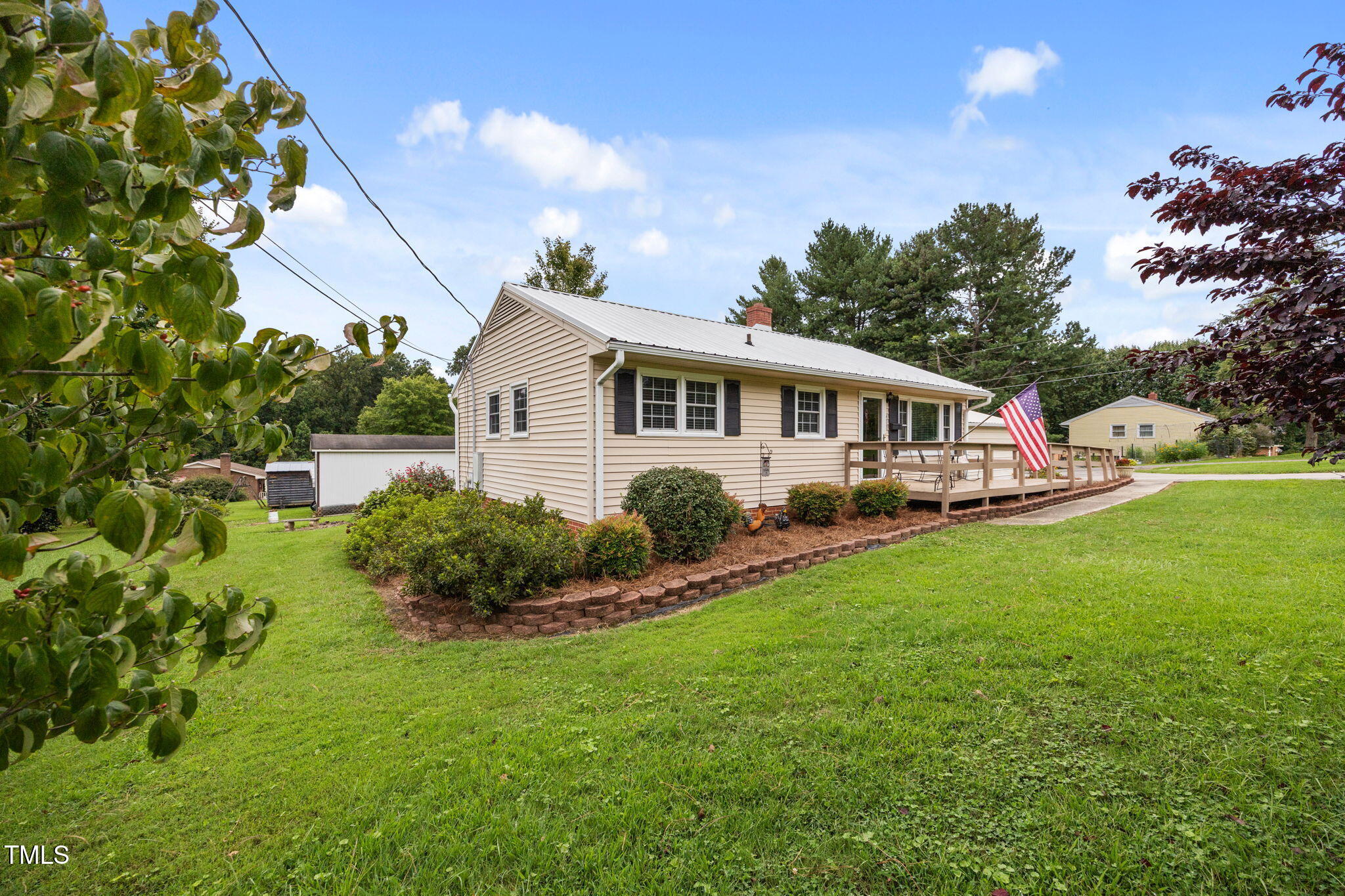 407 North 9th Street Mebane, NC 27302 - Photo 3 of 42 a front view of a house with garden