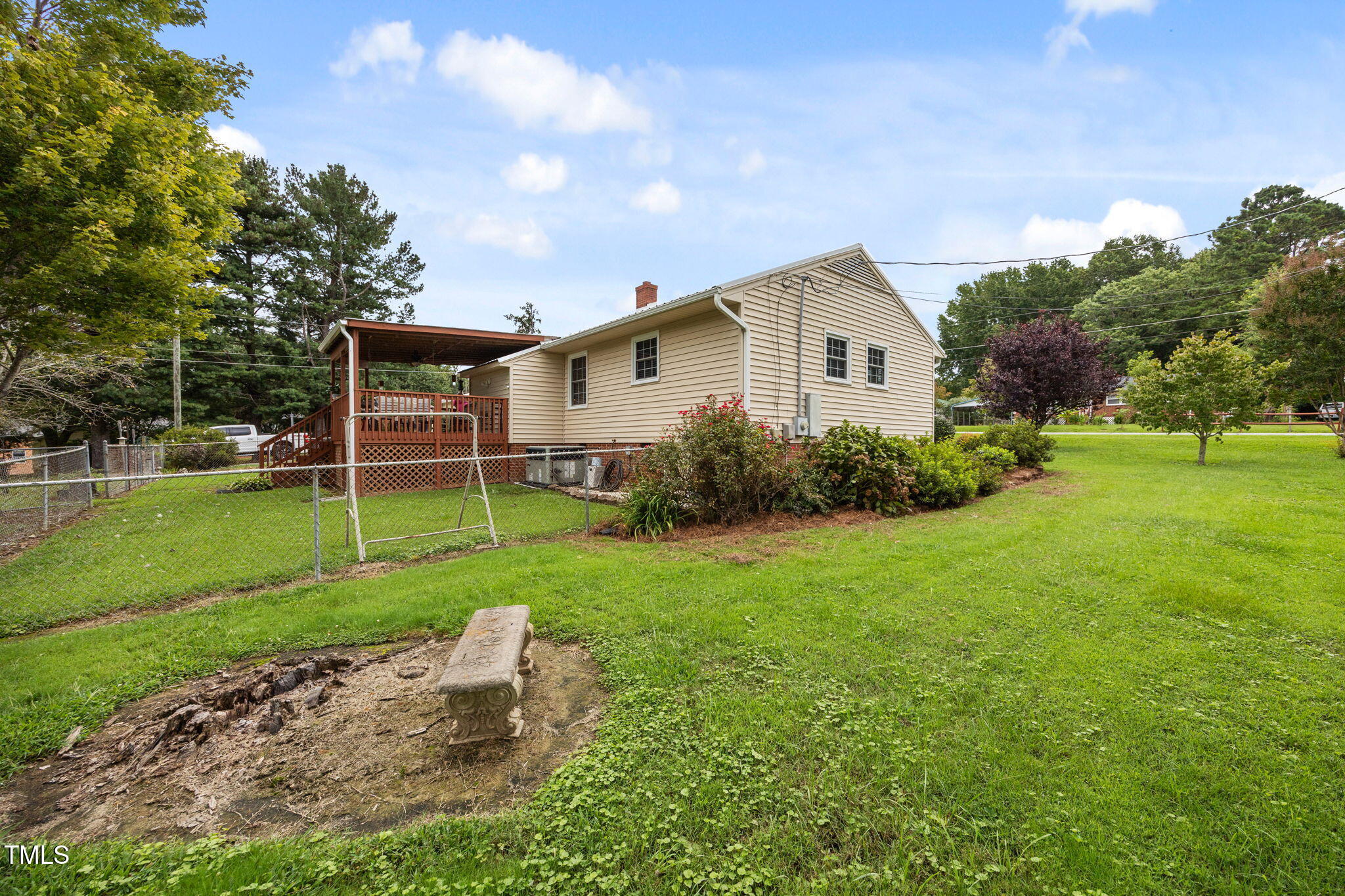 407 North 9th Street Mebane, NC 27302 - Photo 36 of 42 a view of a house with yard and a garden