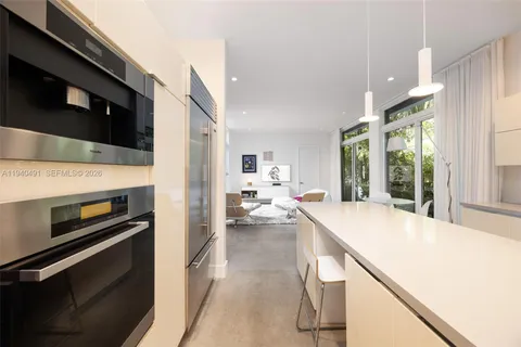 a kitchen with stove and cabinets