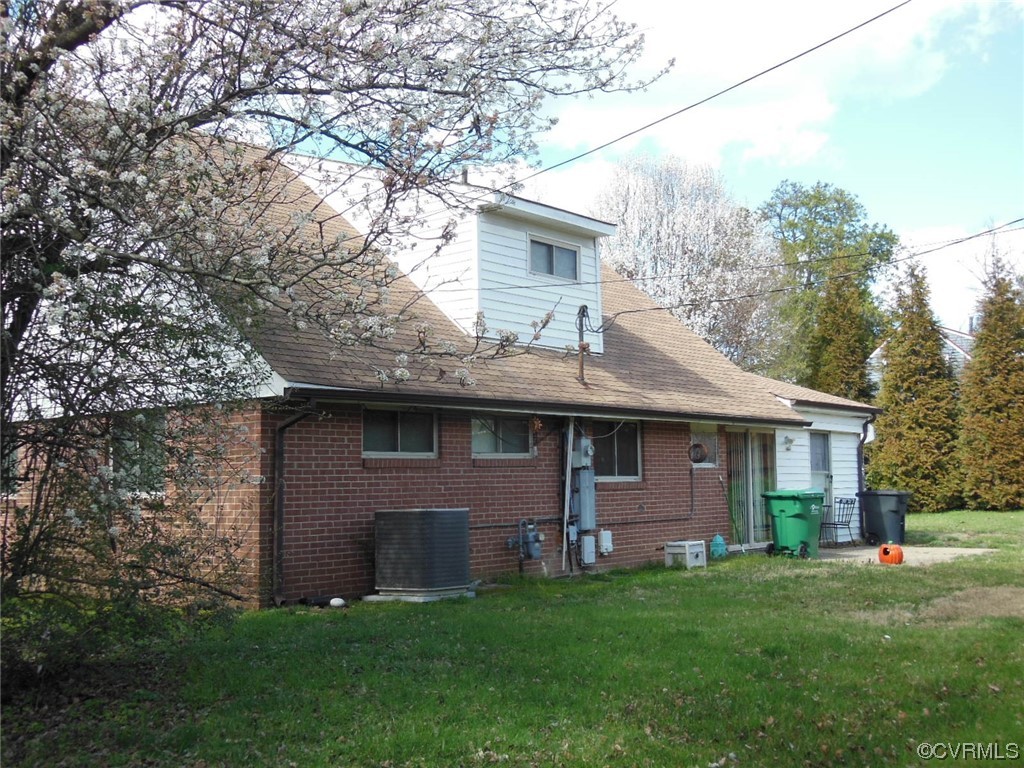 1305 Mormac Road Henrico, VA 23229 - Photo 5 of 6 Rear of property with a yard and central AC