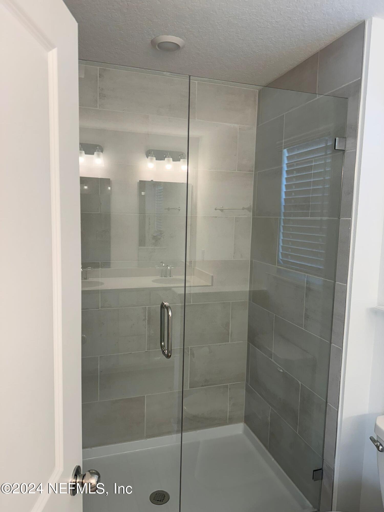 362 Belfort Court St. Augustine, FL 32092 - Photo 11 of 29 a bathroom with a shower