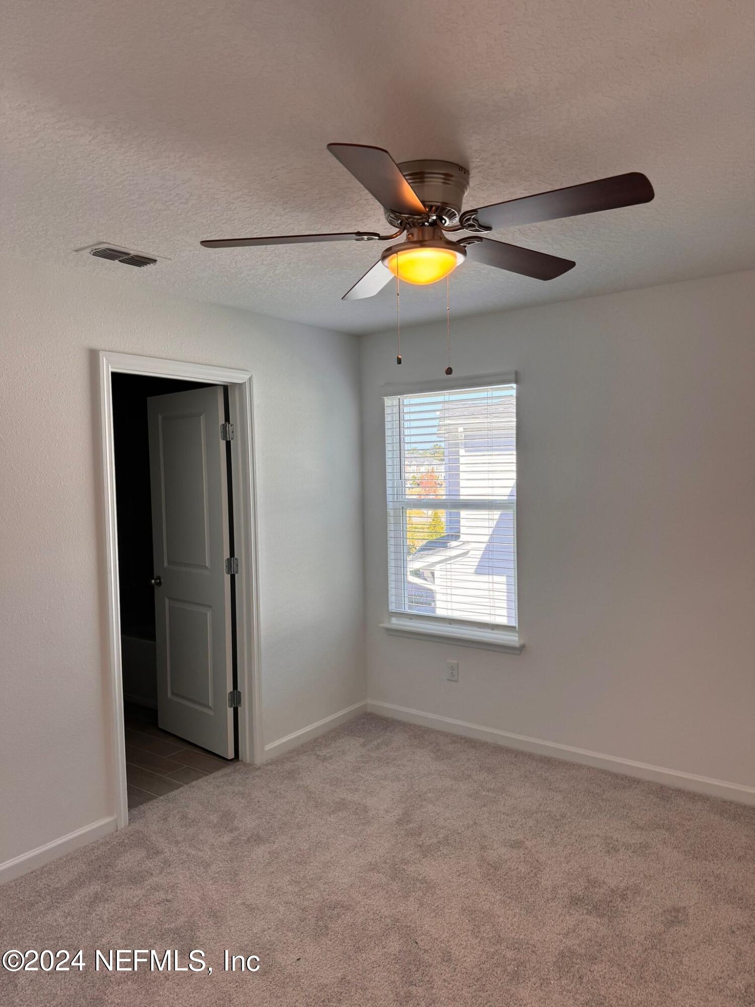 362 Belfort Court St. Augustine, FL 32092 - Photo 13 of 29 a view of a livingroom with a fan and window