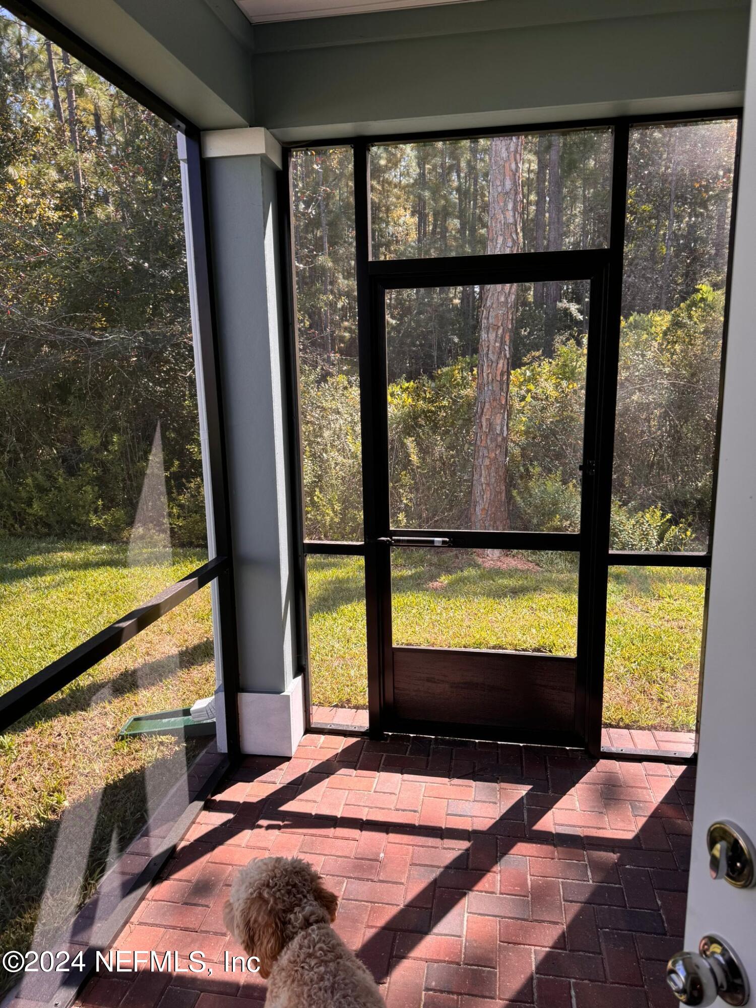 362 Belfort Court St. Augustine, FL 32092 - Photo 6 of 29 a view of a living room and floor to ceiling window