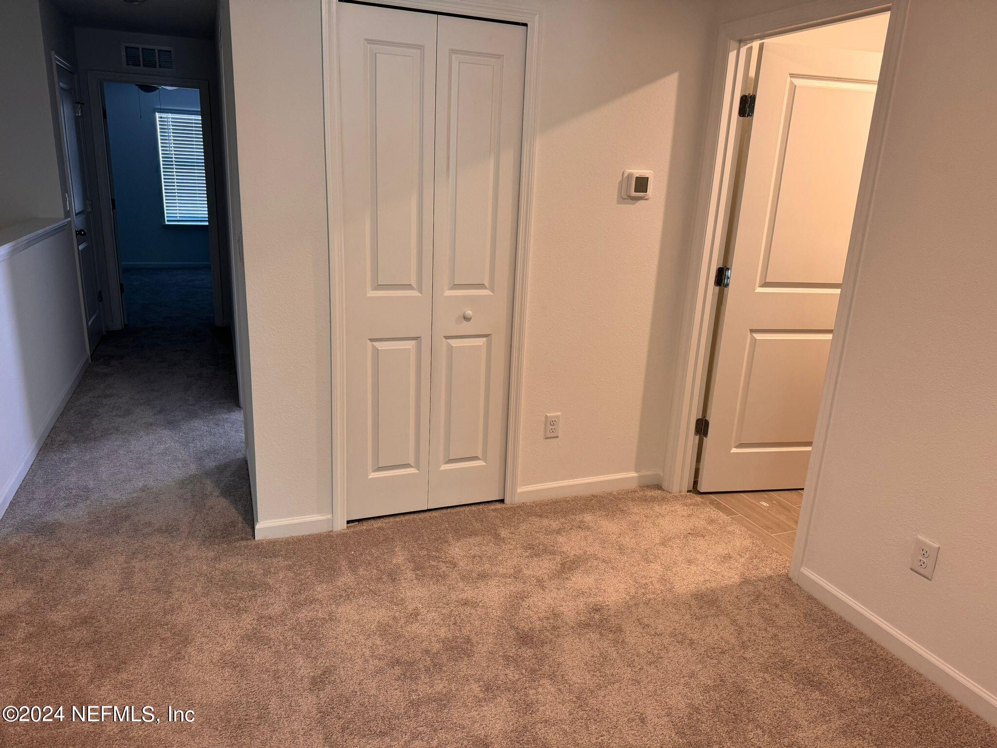 362 Belfort Court St. Augustine, FL 32092 - Photo 7 of 29 an empty room with cabinet door