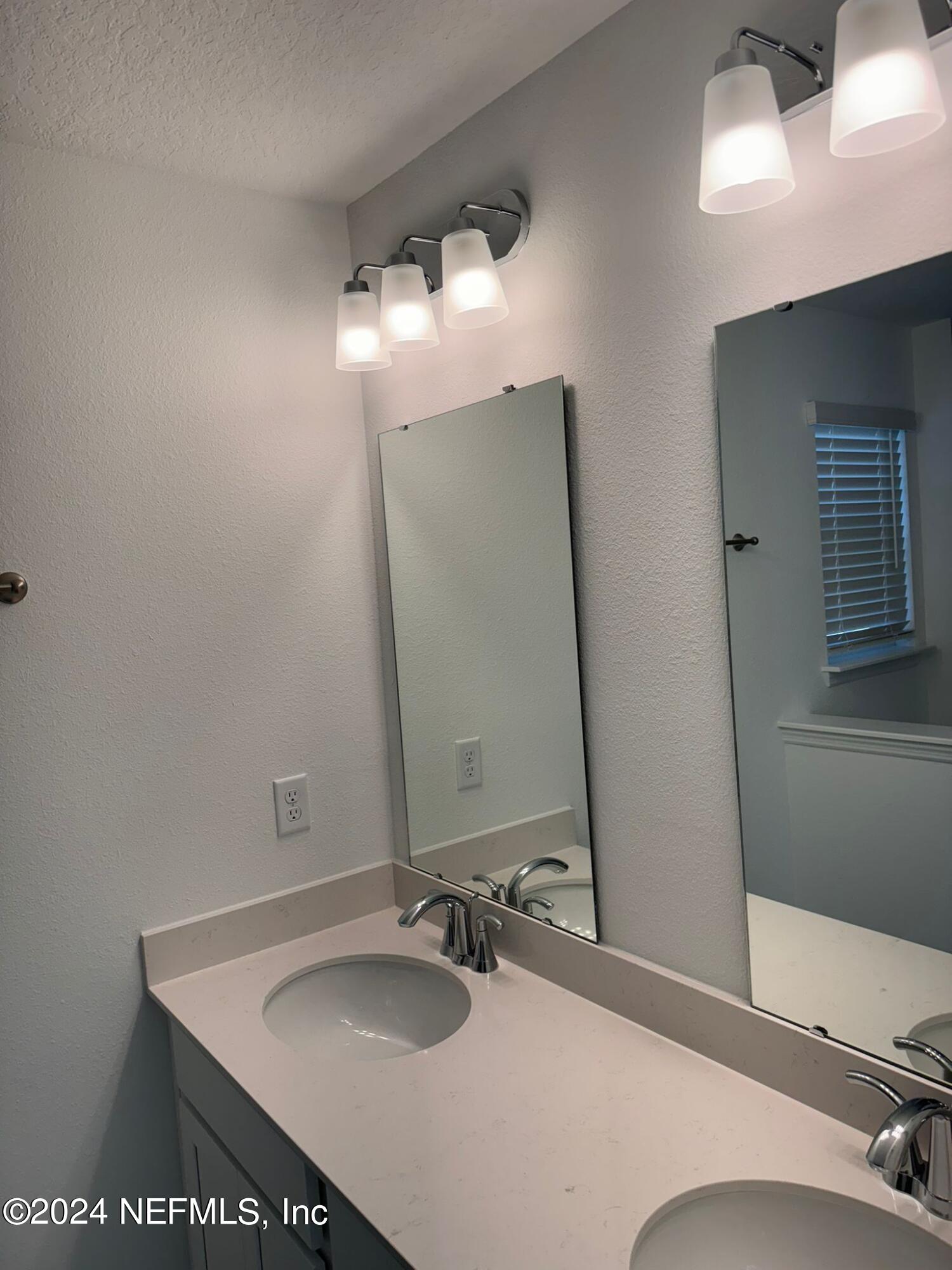 362 Belfort Court St. Augustine, FL 32092 - Photo 10 of 29 a bathroom with a sink and a mirror
