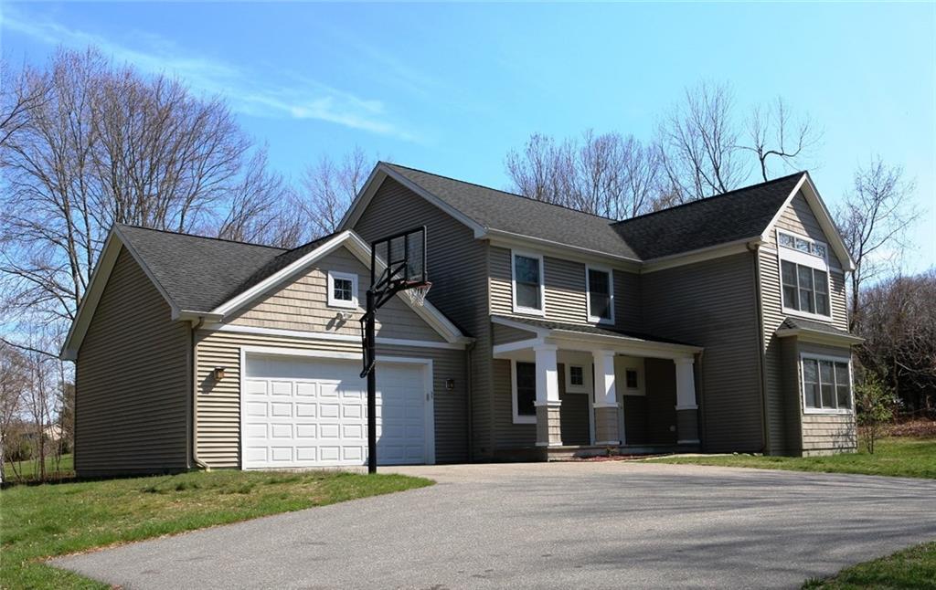 33 Lathrop Road Waterford, CT 06375 - Photo 1 of 1 a front view of a house with a garden