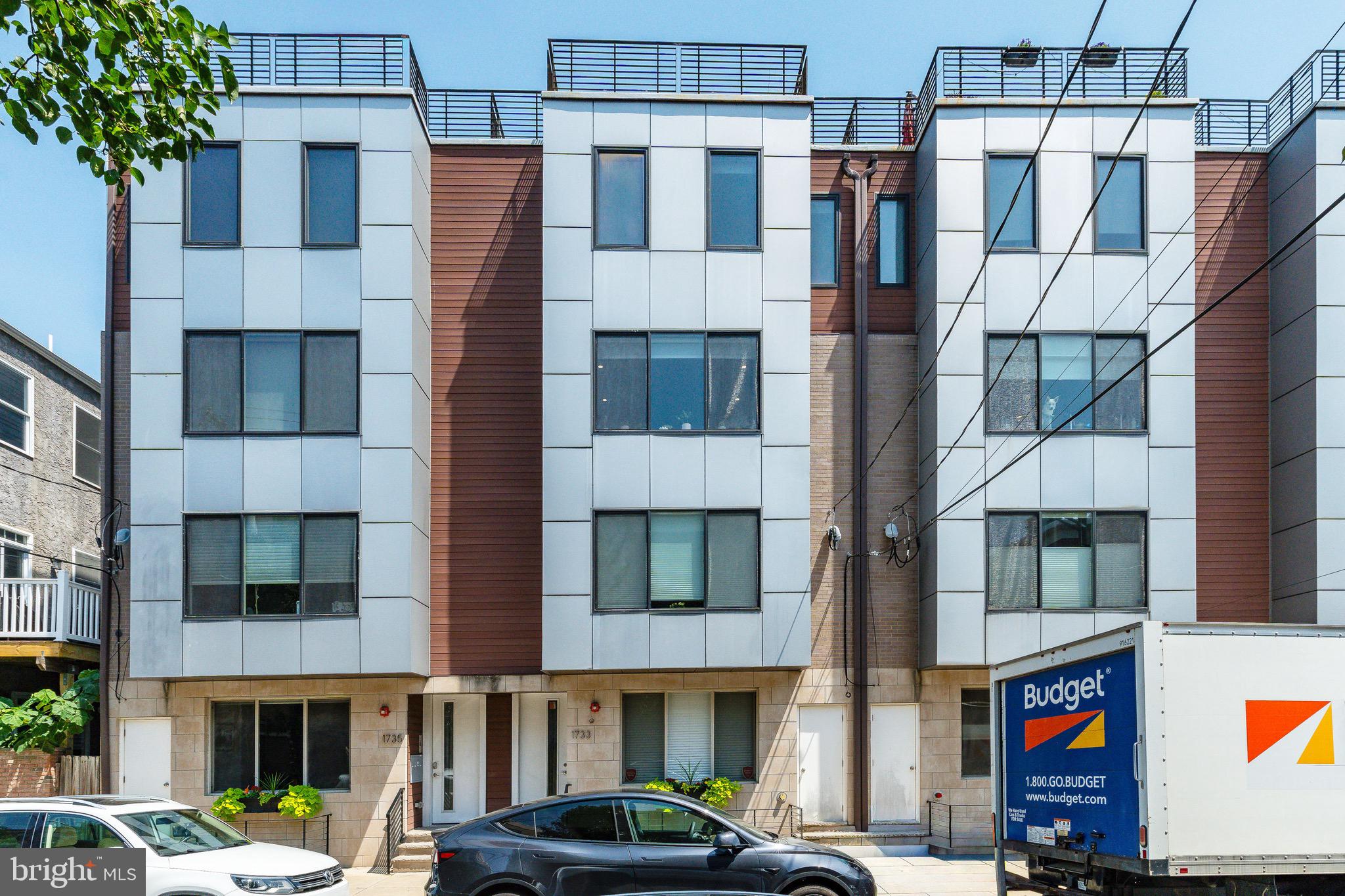 1733 Carpenter Street, Unit D Philadelphia, PA 19146 - Photo 1 of 37 a front view of a building with street