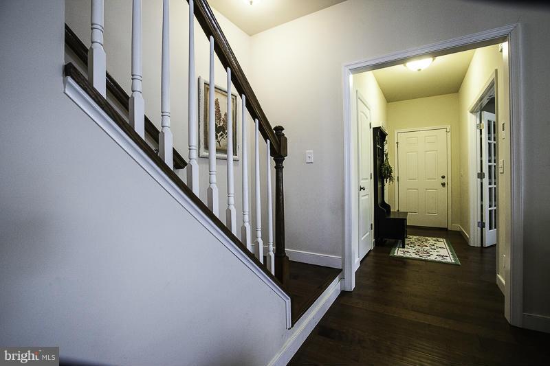 803 Sunken Road Fredericksburg, VA 22401 - Photo 11 of 23 a view of a hallway with wooden floor and staircase
