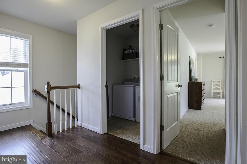 803 Sunken Road Fredericksburg, VA 22401 - Photo 13 of 23 a view of a hallway with wooden floor and a window