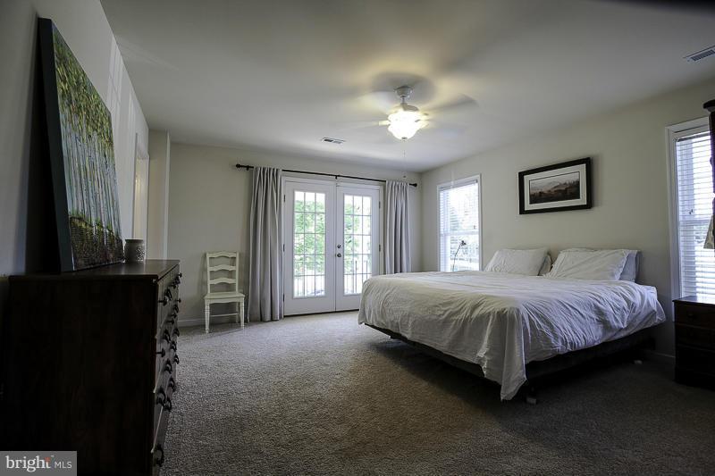 803 Sunken Road Fredericksburg, VA 22401 - Photo 14 of 23 a spacious bedroom with a bed and a window