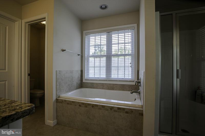 803 Sunken Road Fredericksburg, VA 22401 - Photo 18 of 23 a bath tub sitting next to a window