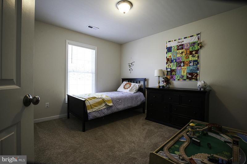 803 Sunken Road Fredericksburg, VA 22401 - Photo 19 of 23 a bedroom with a bed and a window