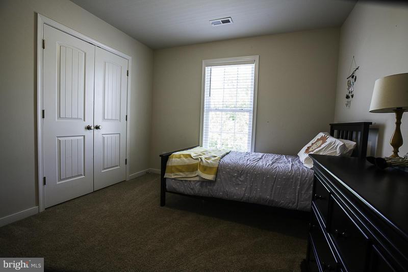 803 Sunken Road Fredericksburg, VA 22401 - Photo 20 of 23 a bedroom with a bed and a window