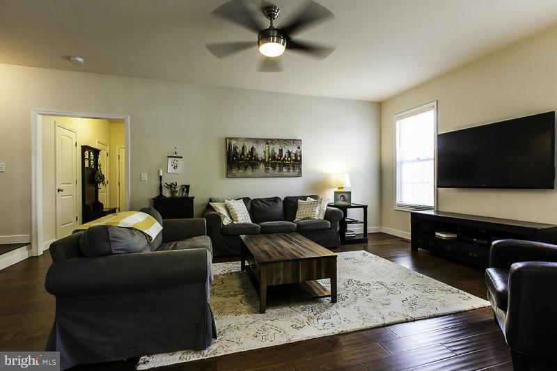 803 Sunken Road Fredericksburg, VA 22401 - Photo 3 of 23 a living room with furniture and a flat screen tv