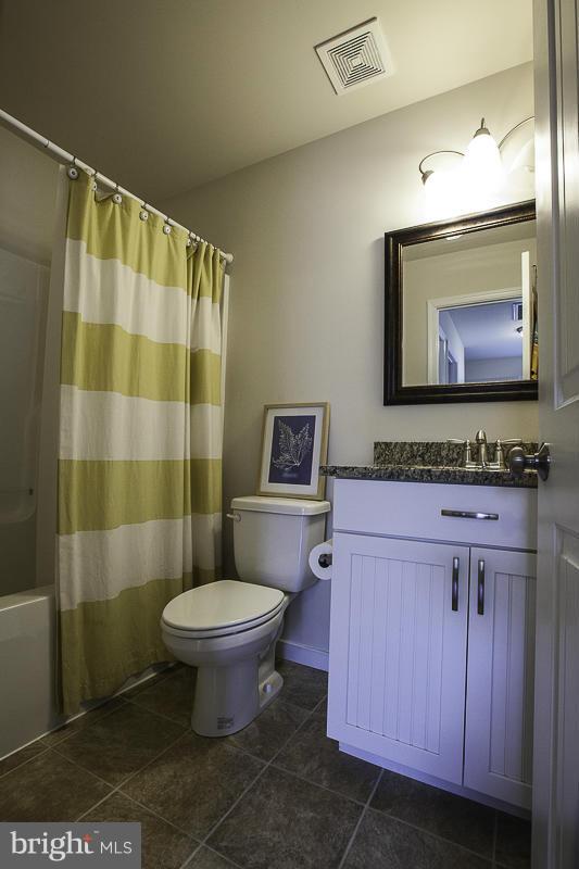 803 Sunken Road Fredericksburg, VA 22401 - Photo 22 of 23 a bathroom with a toilet sink and mirror