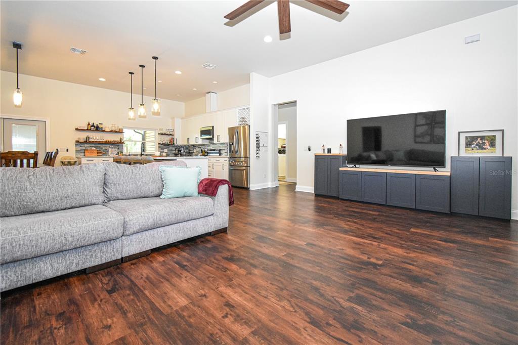 7890 Southwest 129th Avenue Cedar Key, FL 32625 - Photo 15 of 45 a living room with furniture and a flat screen tv