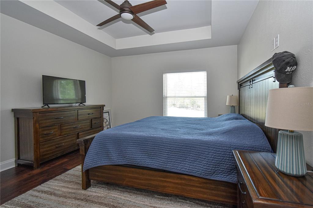 7890 Southwest 129th Avenue Cedar Key, FL 32625 - Photo 19 of 45 a bed room with a bed and a television
