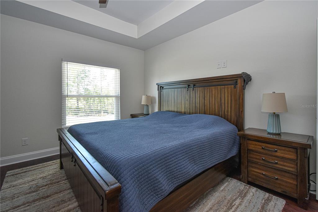 7890 Southwest 129th Avenue Cedar Key, FL 32625 - Photo 20 of 45 a bed sitting in a bedroom next to a window