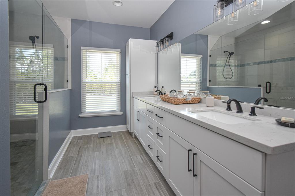 7890 Southwest 129th Avenue Cedar Key, FL 32625 - Photo 23 of 45 a spacious bathroom with double vanity and a mirror