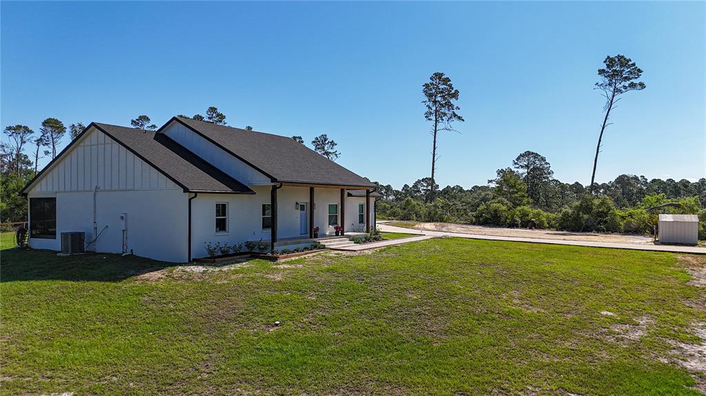 7890 Southwest 129th Avenue Cedar Key, FL 32625 - Photo 3 of 45 a house view with a garden space