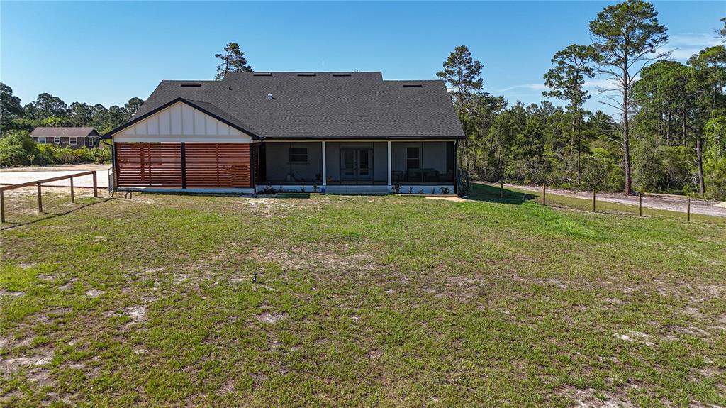 7890 Southwest 129th Avenue Cedar Key, FL 32625 - Photo 37 of 45 a aerial view of a house next to a yard with wooden fence