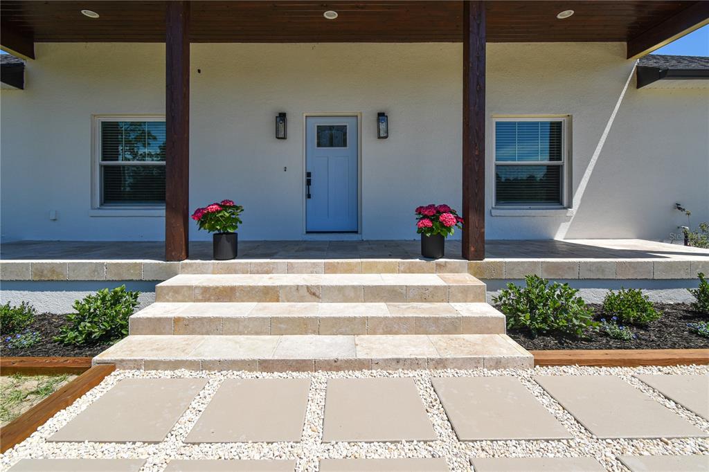 7890 Southwest 129th Avenue Cedar Key, FL 32625 - Photo 4 of 45 a view of a lobby with a bench and potted plants