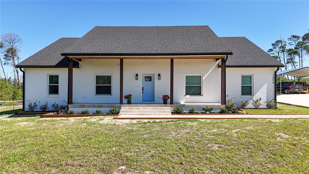 7890 Southwest 129th Avenue Cedar Key, FL 32625 - Photo 45 of 45 front view of a house with a yard