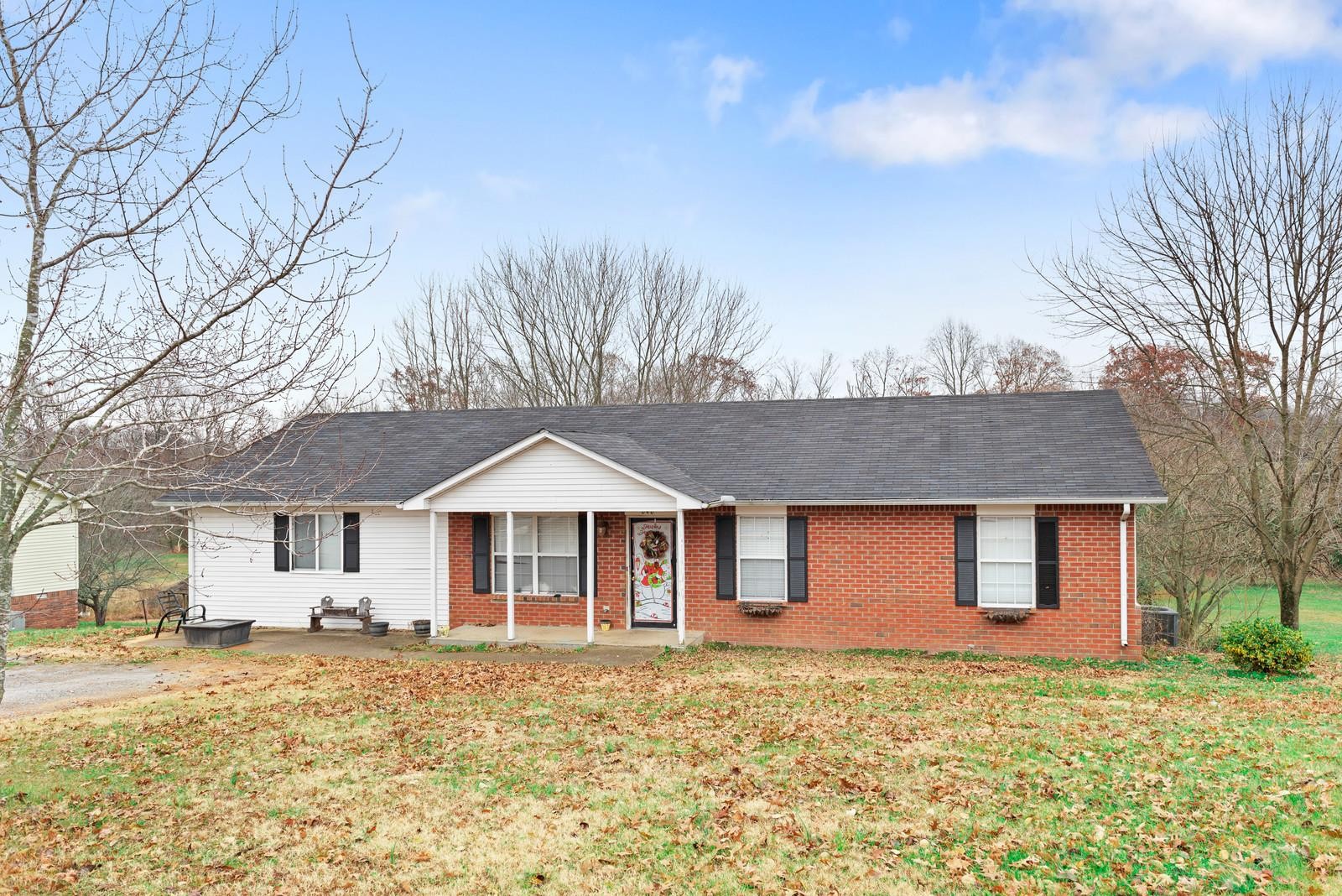 646 Butler Road Portland, TN 37148 - Photo 1 of 1 a front view of a house with a yard