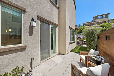 a outdoor space with patio couch and chairs
