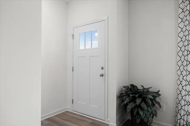 a view of a entryway with wooden floor